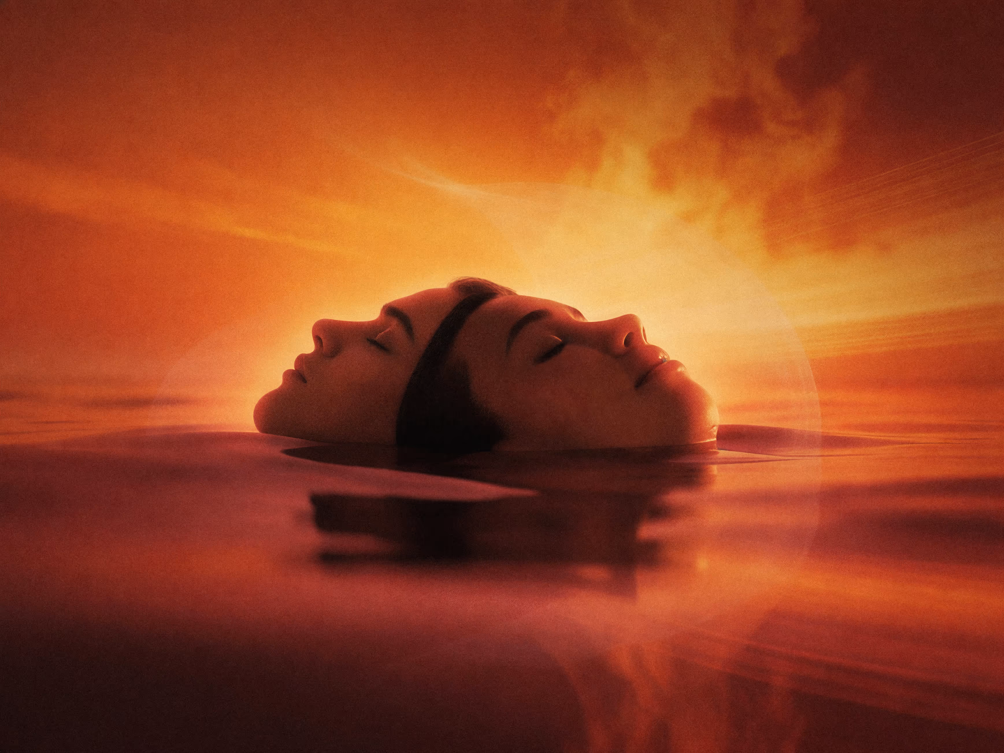 A woman and a man in warm water with ambient lighting
