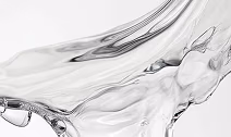 Clear SŌWLS Añejo Cristalino tequila on a white background